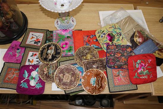 A collection of Chinese embroidered silk panels and mats
